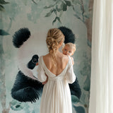 Children's bedroom showcasing panda wall mural with reading nook and playful decor