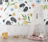Panda nursery wallpaper in soft pastels bringing charm to a modern nursery with white furniture