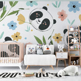 Floral panda wallpaper brightening up a baby's changing area