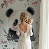 Pink floral panda wallpaper transforming a baby's room