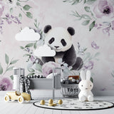 Watercolor panda wall mural brightening a child's reading nook with gentle floral details