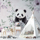 Floral panda wallpaper adding charm to a baby's nursery with rocking chair and soft lighting