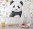 Panda nursery wallpaper in a bright modern nursery with white furniture and soft pink accents