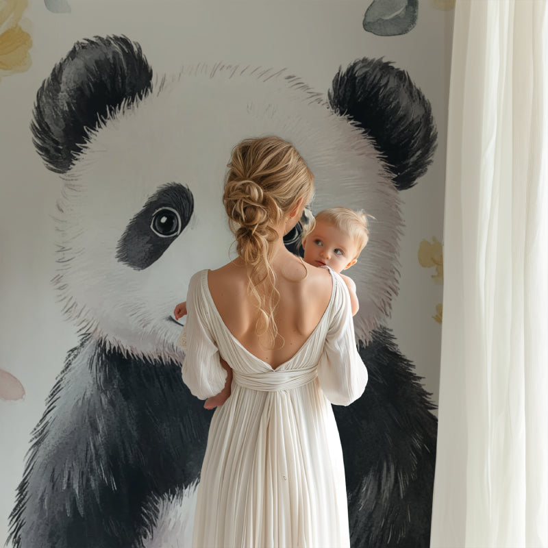 Watercolor panda wall mural in a playroom with natural wood elements