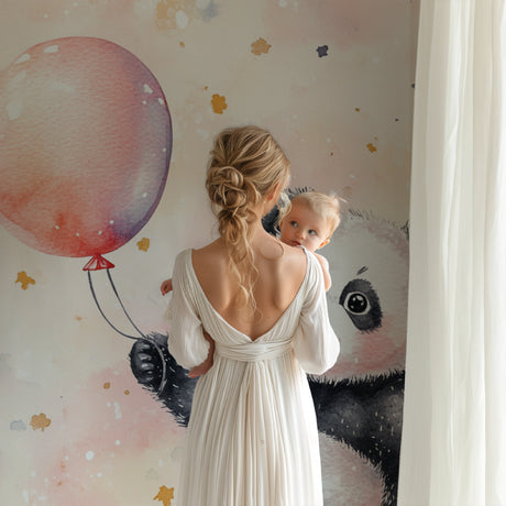 Pink Panda Wallpaper creating a dreamy atmosphere in a modern nursery with white furniture