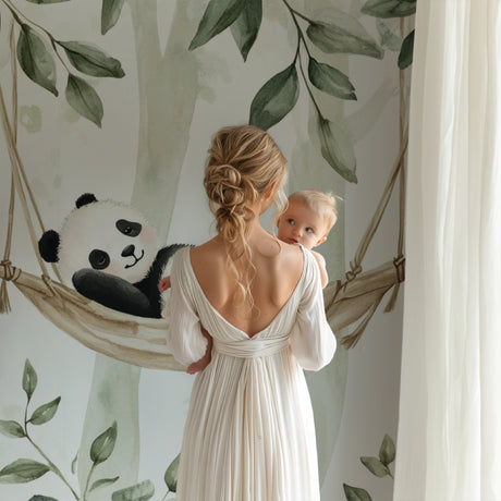 Panda wallpaper mural creating a peaceful atmosphere in a modern nursery with white furniture
