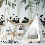 Baby room with green and white panda mural wallpaper creating a calm environment