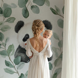 Panda and eucalyptus wallpaper adding charm to a playroom with wooden accents