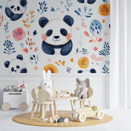 Panda wallpaper mural in bright nursery with white furniture showing watercolor pandas and orange flowers