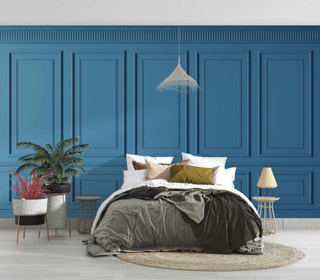 Blue wall paneling wallpaper creating elegant depth in a modern living room with grey sofa and natural light
