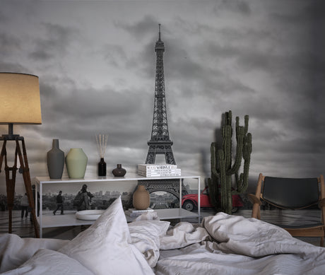 Paris cityscape wallpaper creating drama in a modern living room with black and white furniture