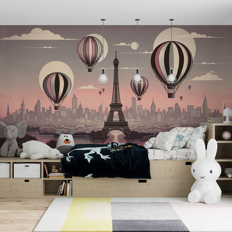 Paris Hot Air Balloon wallpaper creates a magical atmosphere in a girl's bedroom, with soft pink sunset tones