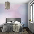 Pastel gradient wallpaper creating a serene atmosphere in a modern living room with minimalist furniture