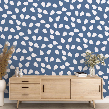 Modern living room featuring blue pattern wallpaper with white drops, creating a peaceful atmosphere