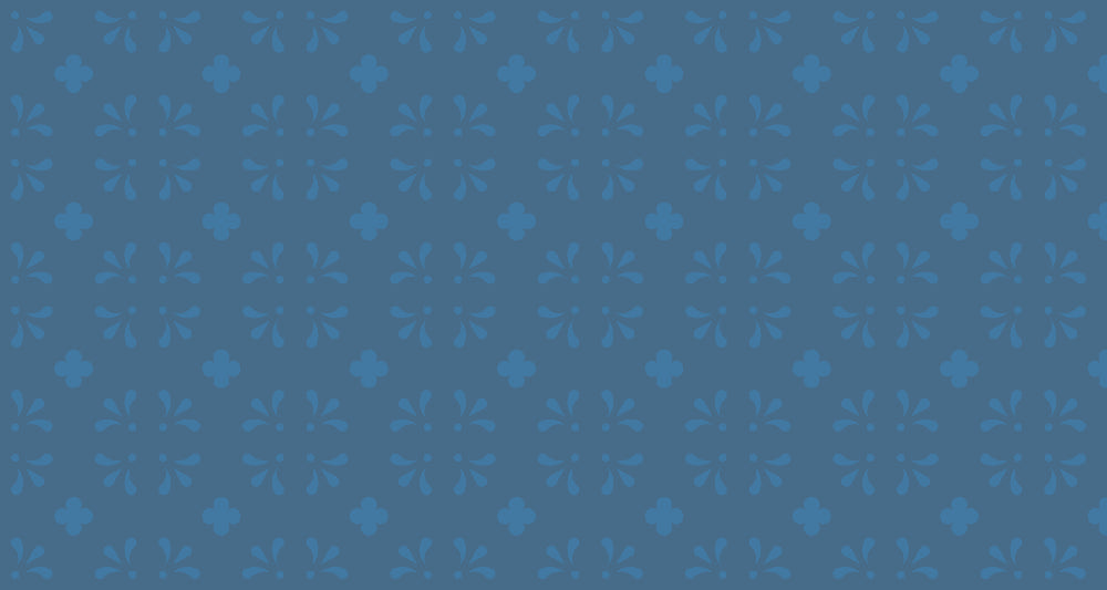 Blue floral pattern wallpaper in a bright modern dining room showing vintage-inspired design with geometric accents