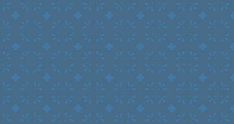 Blue floral pattern wallpaper in a bright modern dining room showing vintage-inspired design with geometric accents