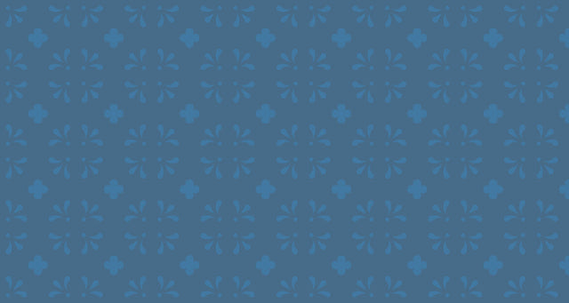 Blue floral pattern wallpaper in a bright modern dining room showing vintage-inspired design with geometric accents