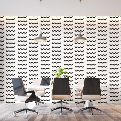 Modern wave pattern wallpaper creating movement in a minimal living room with white sofa and black accents