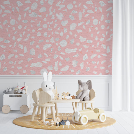 Pink terrazzo pattern wallpaper creating a modern accent wall in a bright living room