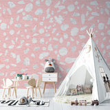 Modern pattern wallpaper installation in a cozy reading nook