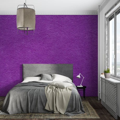 Purple textured wallpaper creating depth in a modern living room with natural lighting