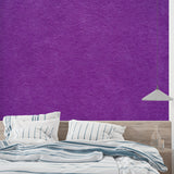 Modern purple textured wallpaper in a stylish bedroom setting