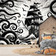 Black and white pirate ship wallpaper creating a bold statement in a modern kids bedroom with minimalist furniture