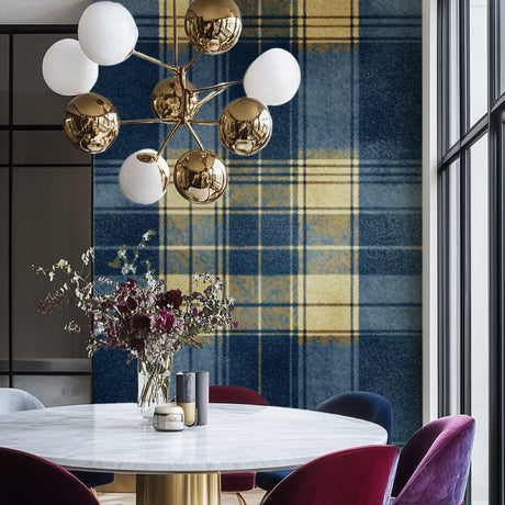 Blue and gold plaid wallpaper creating warmth in a modern dining room with natural lighting