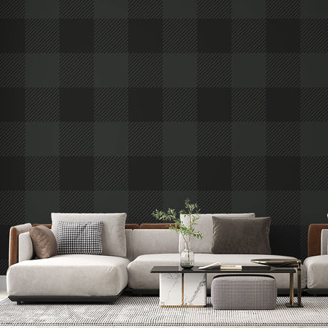 Green Buffalo Check Wallpaper creating a cozy atmosphere in a modern living room with leather furniture and natural light