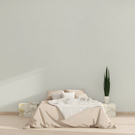 Minimalist beige wallpaper in modern living room with natural light streaming through floor-to-ceiling windows