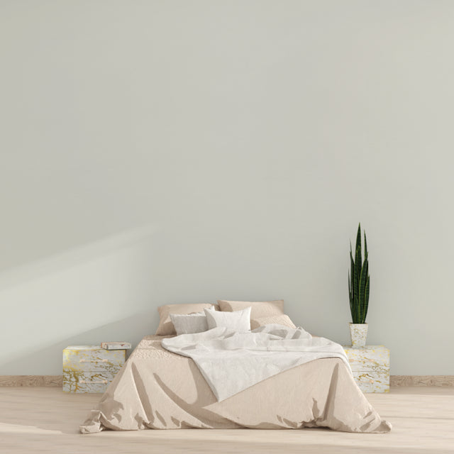 Minimalist beige wallpaper in modern living room with natural light streaming through floor-to-ceiling windows