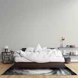 Plain beige wall mural creating serene atmosphere in minimal bedroom setting