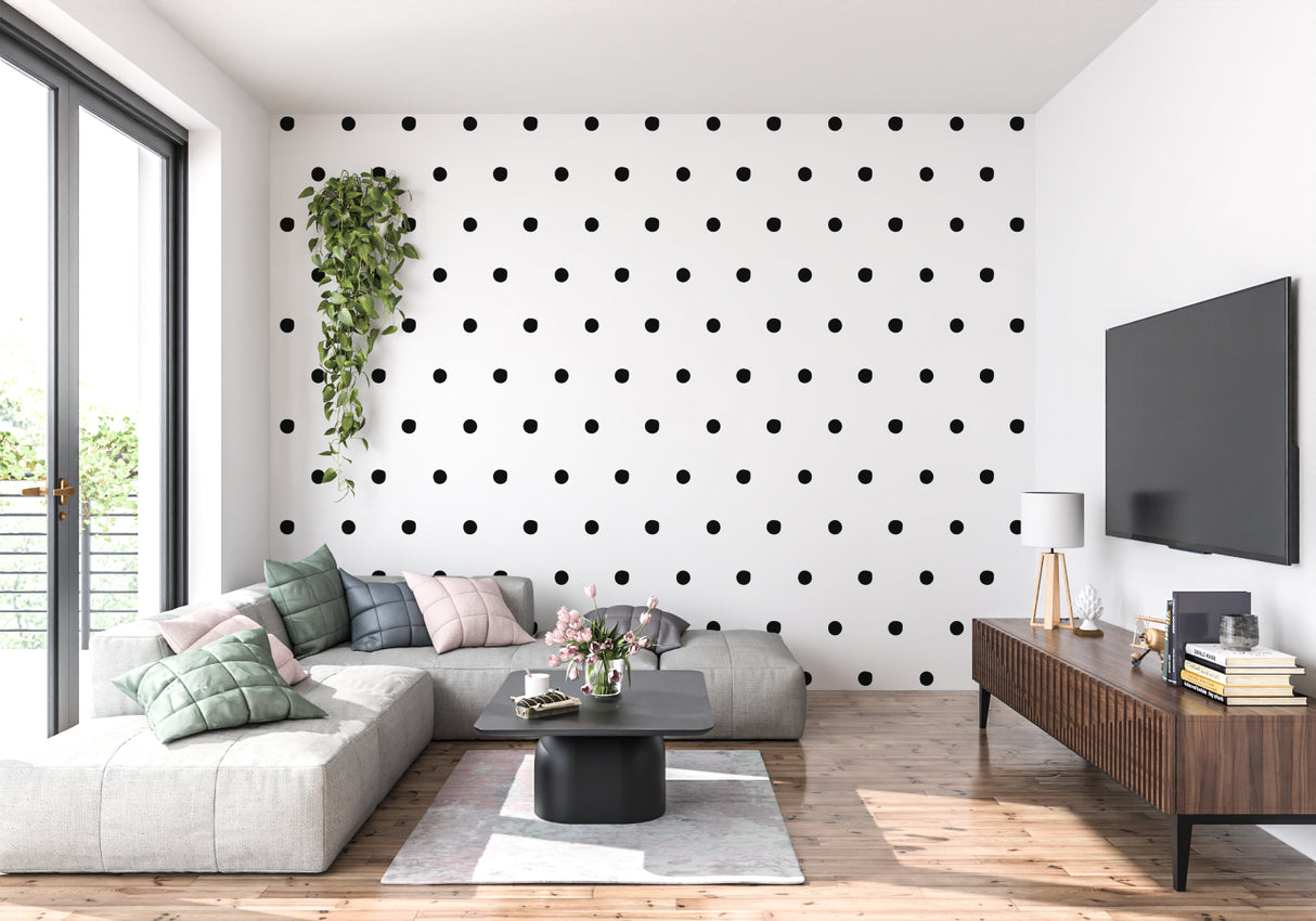 Black and white polka dot mural adding character to a modern dining room