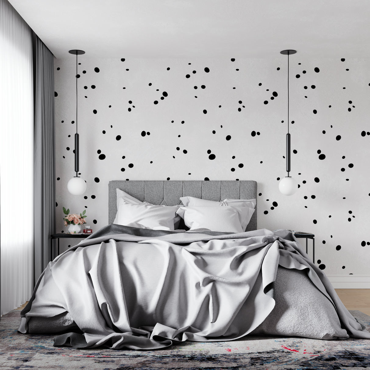 Black and white dot pattern wallpaper in a minimalist home office space