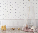 Silver dot wallpaper adding elegance to a home office space with afternoon glow