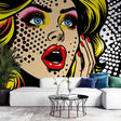 Pop art wallpaper mural bringing bold comic style to a modern living room with white furniture and natural light