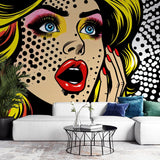 Pop art wallpaper mural bringing bold comic style to a modern living room with white furniture and natural light