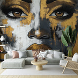 Black and gold abstract portrait wallpaper creating a bold statement in a modern living room with minimalist furniture
