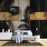 Black and gold portrait mural wallpaper creating dramatic impact in a modern living room with high ceilings