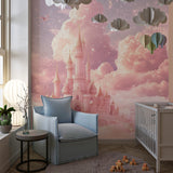 Princess castle wallpaper in magical girl's bedroom with pink bed and fairy lights