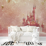 Pink castle mural wallpaper displayed in a dreamy nursery with soft furnishings