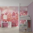 Pink crystal crown princess wallpaper in a little girl's bedroom with soft lighting and matching decor