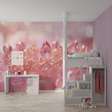 Pink crystal crown princess wallpaper in a little girl's bedroom with soft lighting and matching decor