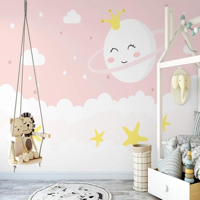 Princess cloud wallpaper creating a magical atmosphere in a cozy nursery with pink and gold accents