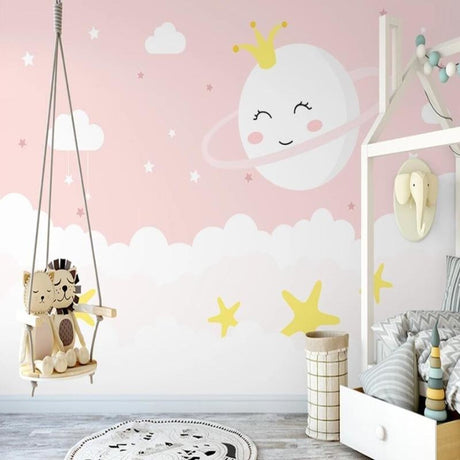 Princess cloud wallpaper creating a magical atmosphere in a cozy nursery with pink and gold accents