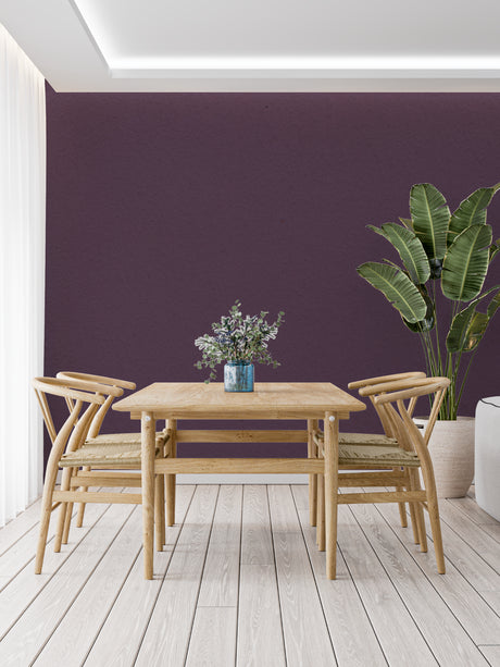 Purple wall mural in modern living room creating a cozy atmosphere with gray sofa and natural light