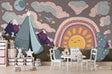 Desert rainbow wallpaper in cozy nursery with rocking chair and soft lighting