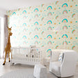 Rainbow wallpaper mockup in bright nursery with white furniture showing pastel colors and cloud pattern
