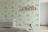 Kids bedroom featuring rainbow cloud wallpaper with matching bedding and decor