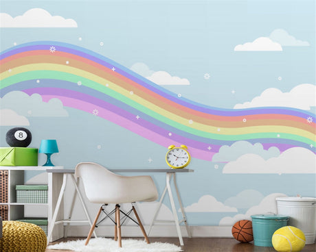 Rainbow wallpaper mural in bright nursery with white furniture showing soft pastel colors and dreamy clouds